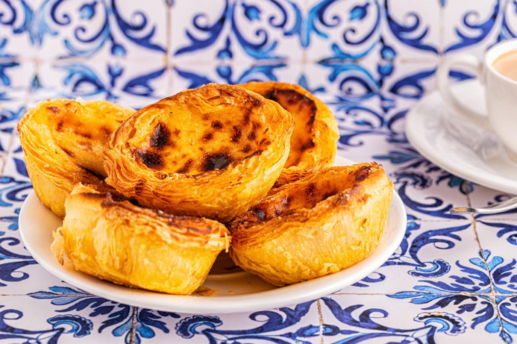 A plate of pastéis de nata on azulejo tiles, Belém